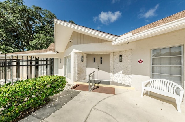 entrance to property with a patio area