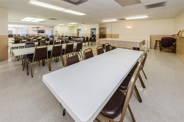 dining area with a drop ceiling