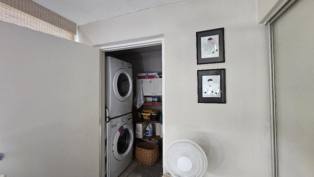 washroom with stacked washer / drying machine