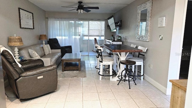 tiled living room featuring ceiling fan