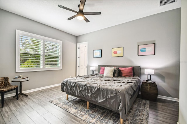 bedroom featuring hardwood / wood-style floors and ceiling fan