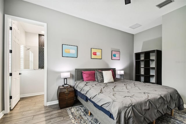 bedroom featuring light hardwood / wood-style floors and ceiling fan