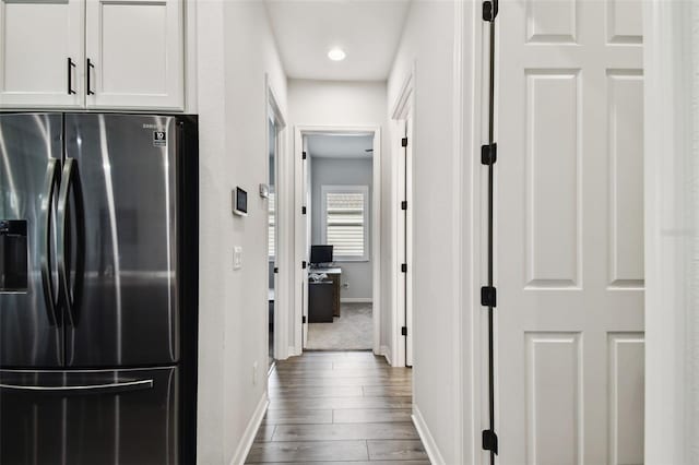 hallway featuring wood-type flooring