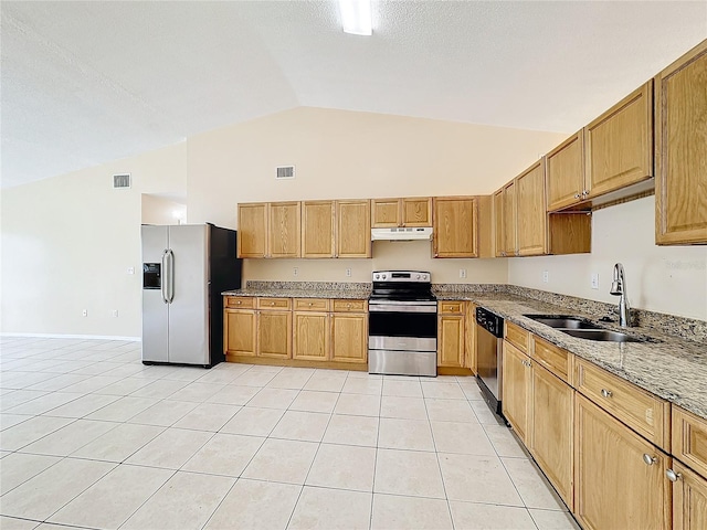 kitchen featuring light tile patterned flooring, sink, light stone counters, appliances with stainless steel finishes, and lofted ceiling