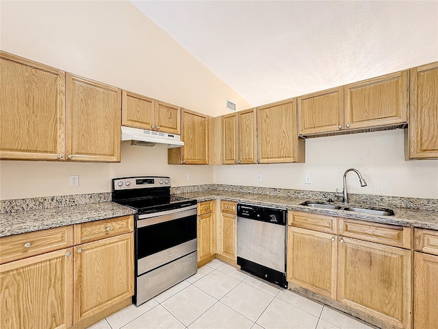 kitchen featuring stainless steel appliances, vaulted ceiling, sink, light tile patterned floors, and light stone countertops