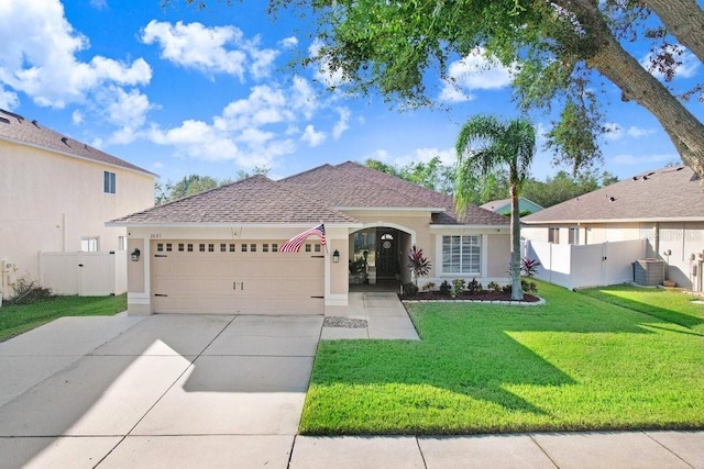 view of front facade featuring a garage and a front lawn