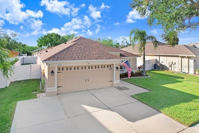 view of front facade with a garage and a front yard