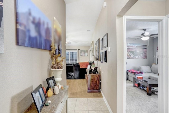 hall with light hardwood / wood-style floors