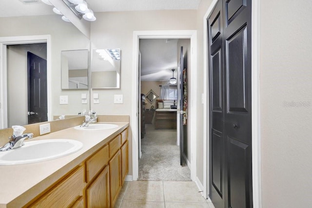 bathroom featuring vanity, tile patterned flooring, and ceiling fan