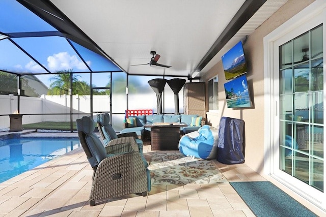 view of pool featuring glass enclosure, a patio, and an outdoor hangout area