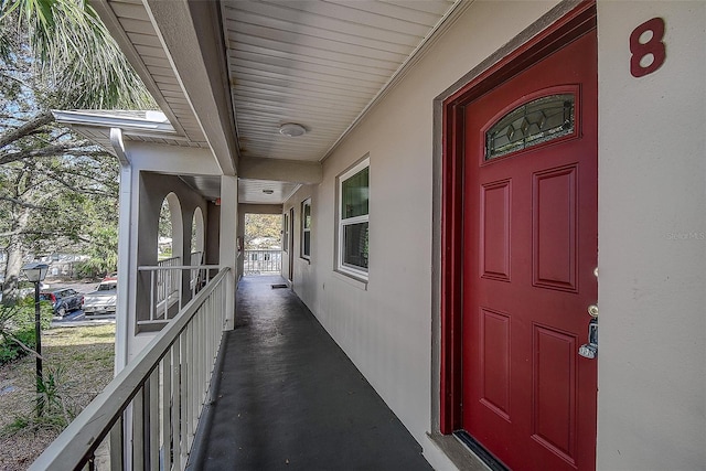 view of exterior entry with a porch