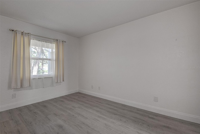 spare room featuring light hardwood / wood-style floors