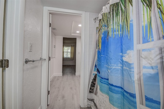 bathroom featuring hardwood / wood-style flooring