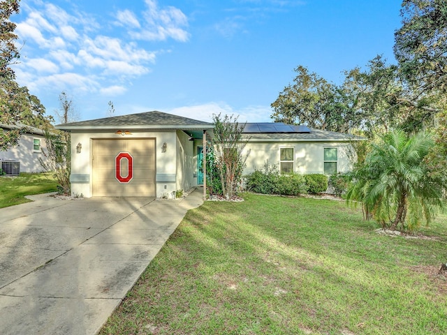 5800 W Spicey Hill Dr, Homosassa, FL 34448 - ranch-style home with stucco siding, solar panels, a front lawn, and driveway