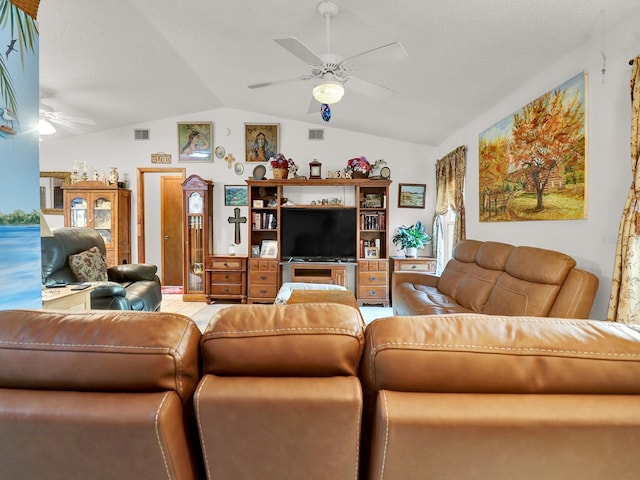 living room with ceiling fan and vaulted ceiling