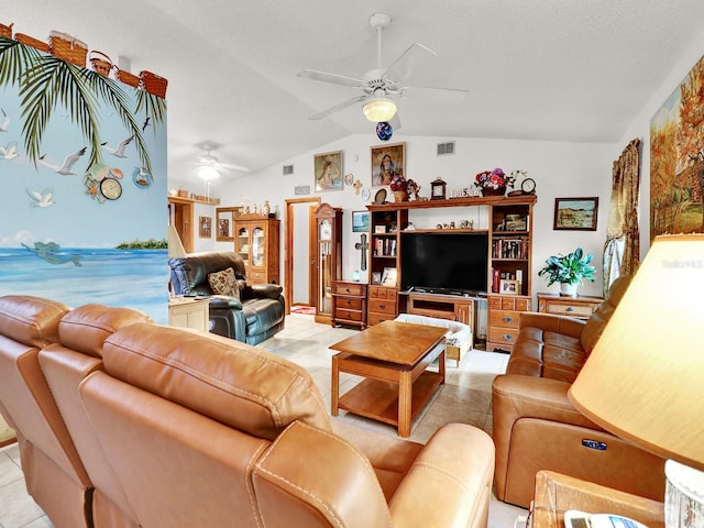 living room with lofted ceiling, light tile patterned floors, and ceiling fan