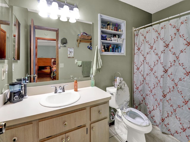 bathroom featuring tile patterned floors, toilet, curtained shower, a textured ceiling, and vanity