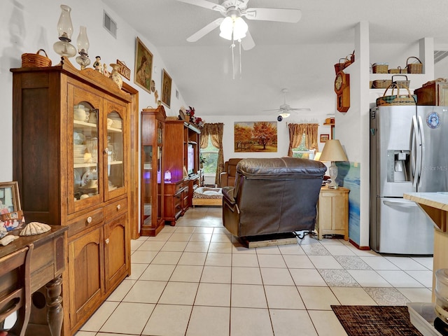 living room featuring light tile patterned floors and ceiling fan