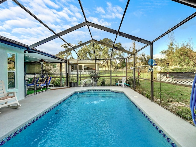 view of pool featuring glass enclosure and a patio