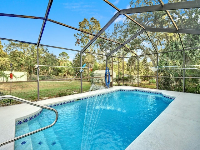 view of swimming pool featuring glass enclosure, a patio area, and a yard