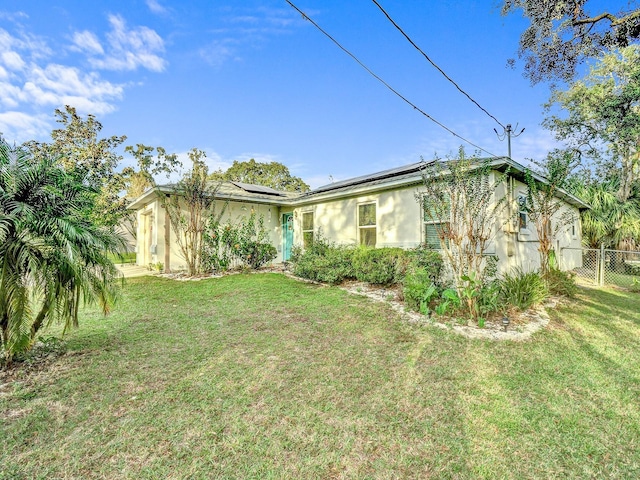 5800 W Spicey Hill Dr, Homosassa, FL 34448 - view of property exterior featuring roof mounted solar panels and stucco siding