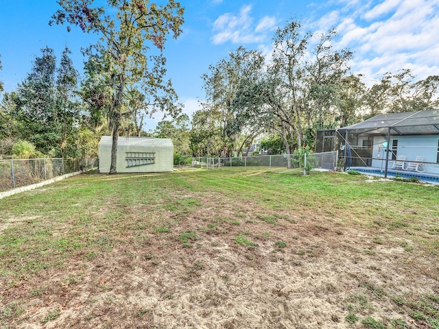 view of yard with a lanai