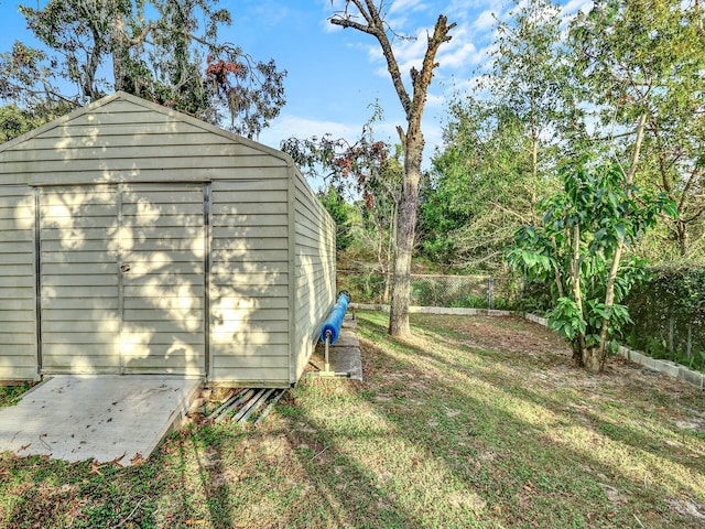 view of side of property with a shed