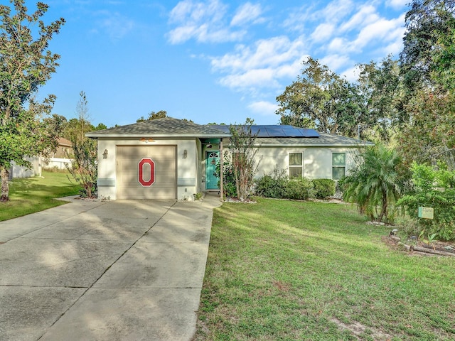 single story home with solar panels and a front lawn