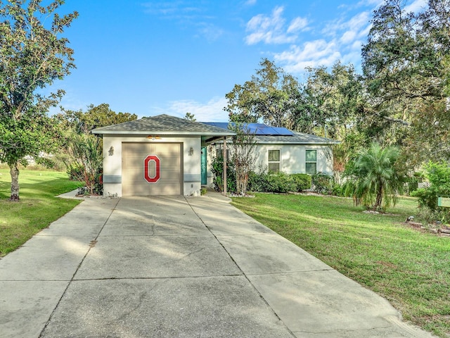 ranch-style home with a front lawn and solar panels