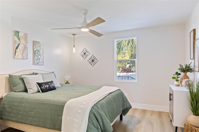 bedroom featuring ceiling fan and light wood-type flooring