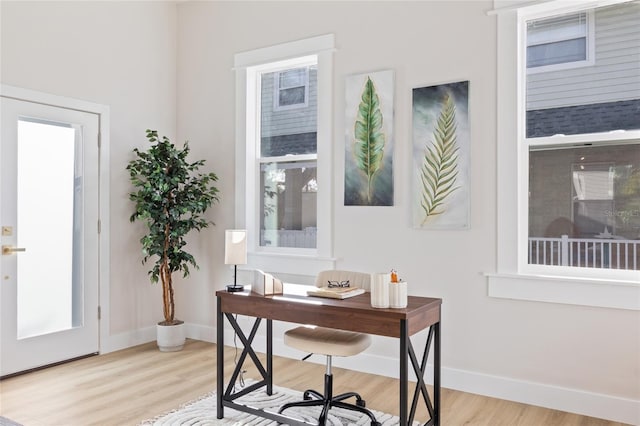 office space with light wood-type flooring