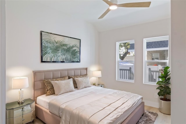 bedroom featuring ceiling fan and light hardwood / wood-style flooring