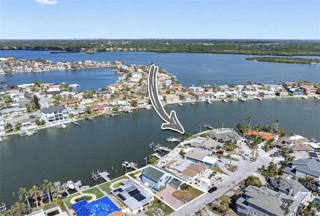 birds eye view of property featuring a water view