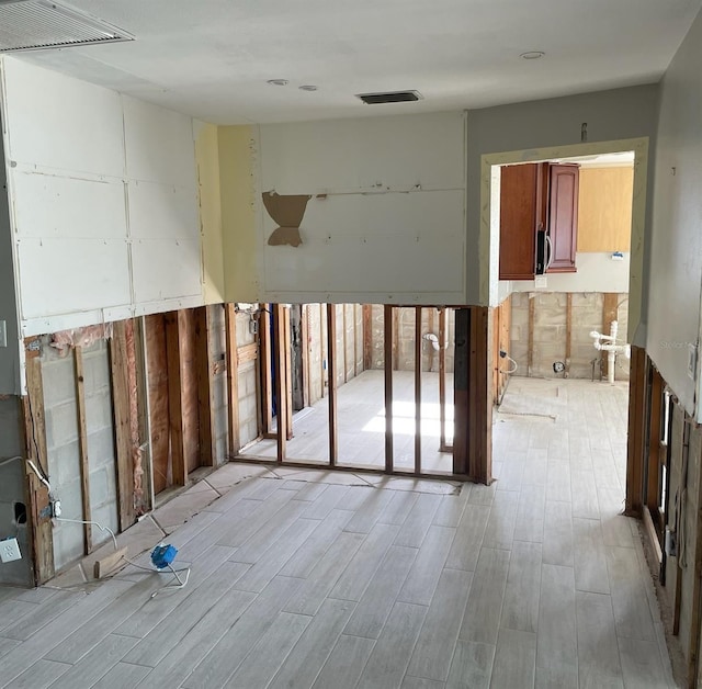 spare room featuring light hardwood / wood-style floors