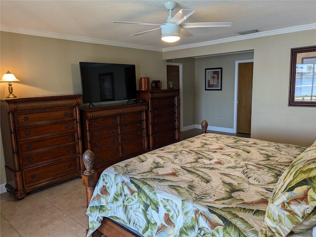 bedroom with ceiling fan, light tile patterned flooring, a textured ceiling, and ornamental molding