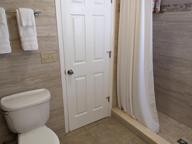 212 Poinciana Ln, Largo, FL 33770 - full bath with a stall shower, toilet, and tile patterned floors