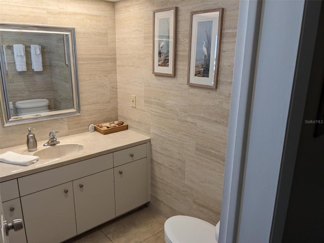 212 Poinciana Ln, Largo, FL 33770 - half bath with toilet, tile walls, vanity, and tile patterned floors