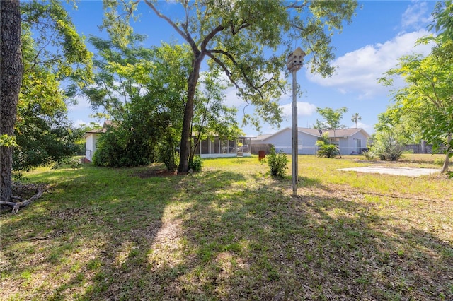 view of yard featuring a sunroom