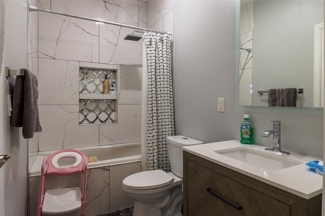 full bathroom with vanity, shower / bath combo, and toilet