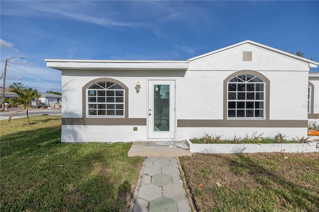 view of front of home with a front yard