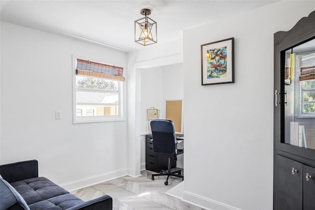 office area with a wealth of natural light and light parquet flooring