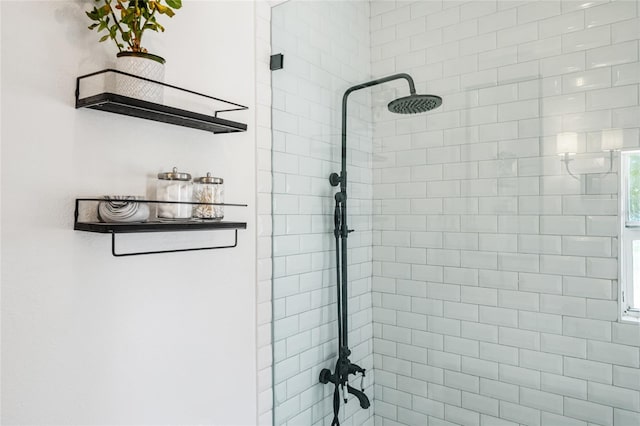 bathroom with a tile shower