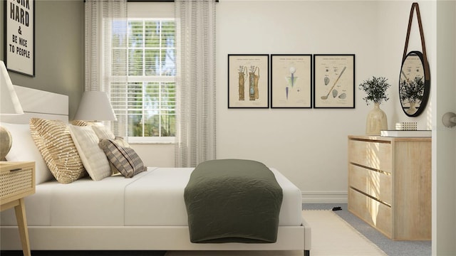 bedroom featuring multiple windows and light carpet