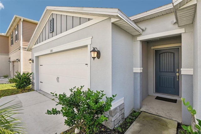 doorway to property featuring a garage