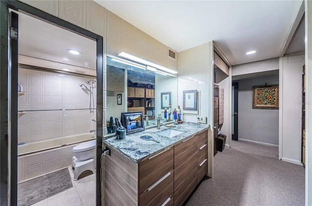 interior space featuring light stone counters, light tile patterned flooring, and sink