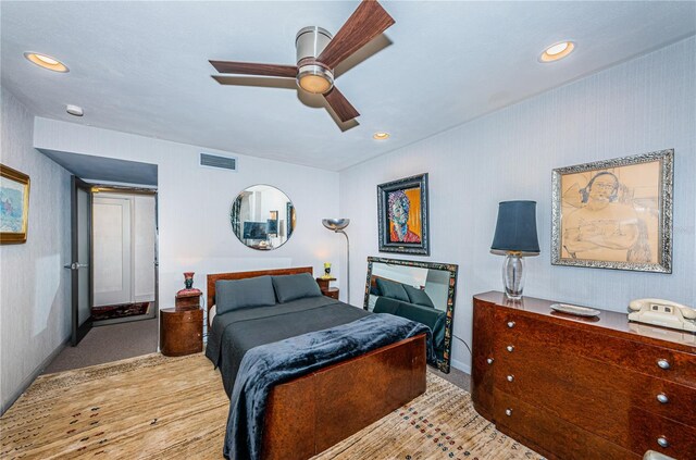 bedroom featuring light wood-type flooring and ceiling fan