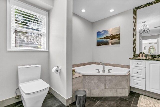 bathroom featuring a garden tub, toilet, recessed lighting, vanity, and tile patterned floors