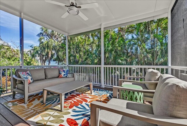 sunroom with a ceiling fan