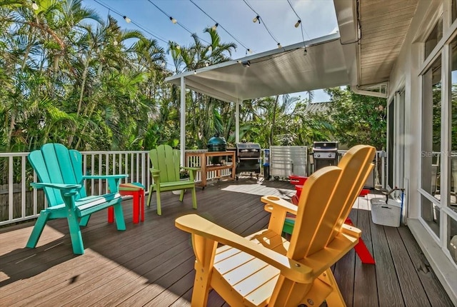 wooden terrace with area for grilling