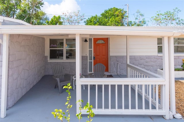 property entrance featuring covered porch